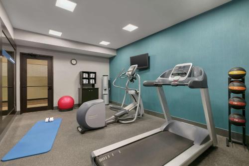 a fitness room with a treadmill and a gym at Hampton Inn Binghamton/Johnson City in Binghamton
