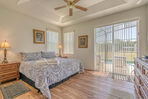 a bedroom with a bed and a ceiling fan at Mickey's Holiday Home in Davenport