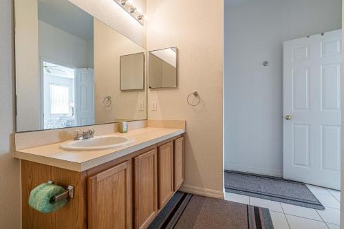 a bathroom with a sink and a mirror at Mickey's Holiday Home in Davenport