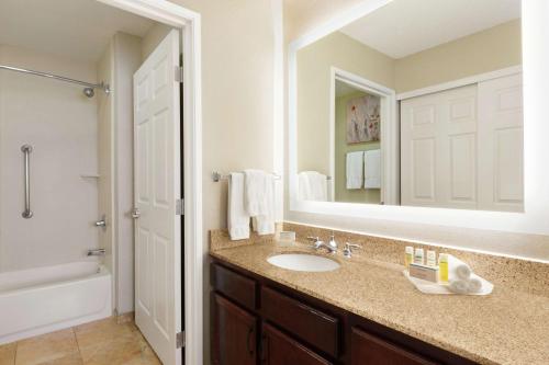 a bathroom with a sink and a mirror at Homewood Suites by Hilton Dallas-DFW Airport N-Grapevine in Grapevine