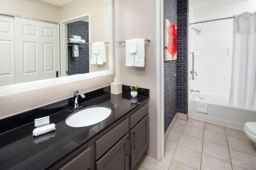 a bathroom with a sink and a mirror at Homewood Suites by Hilton Columbus-Dublin in Dublin