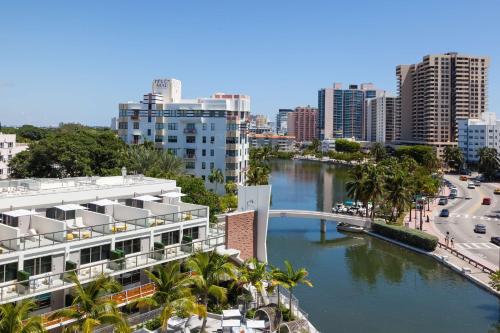 a view of a city with a river and buildings at The Gates Hotel South Beach in Miami Beach