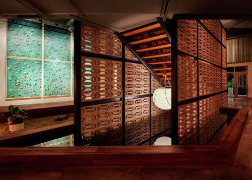 a wine cellar with wooden walls and windows at The Gates Hotel South Beach in Miami Beach