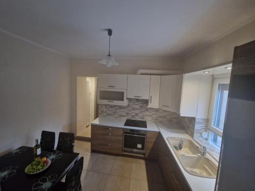 a kitchen with a sink and a stove at Kalipso home in Mytilini