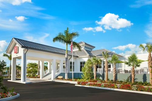 a rendering of the front of a hotel with palm trees at Hilton Garden Inn Key West / The Keys Collection in Key West