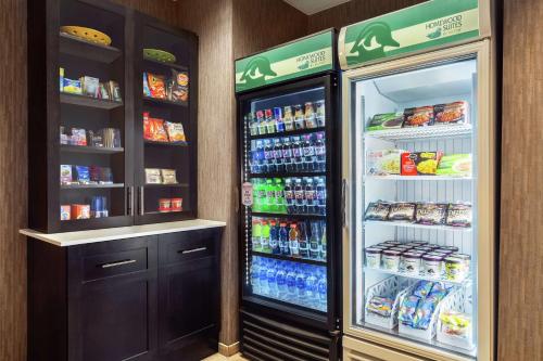 a refrigerator with its door open in a store at Homewood Suites by Hilton Erie in Erie