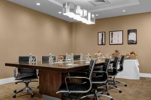 a conference room with a long table and chairs at Hilton Garden Inn New York - Times Square Central in New York