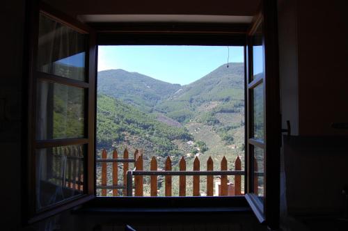 an open window with a view of a mountain at Casa VALGRAZIOSA in Calci
