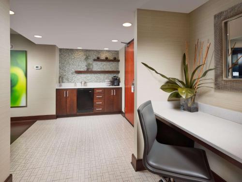 a office with a desk and a chair in a room at DoubleTree by Hilton Hotel Chattanooga Downtown in Chattanooga