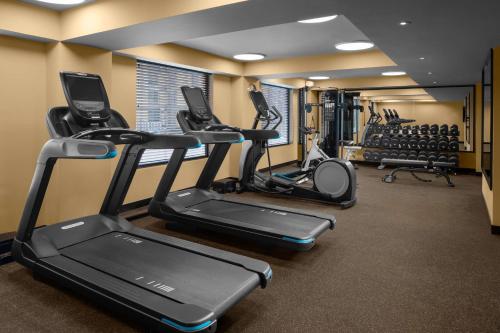 a gym with treadmills and elliptical machines at ROK Hotel Kingston Tapestry Collection By Hilton in Kingston