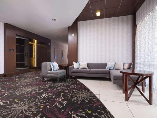 a living room with a couch and a table at DoubleTree by Hilton Hotel Chattanooga Downtown in Chattanooga