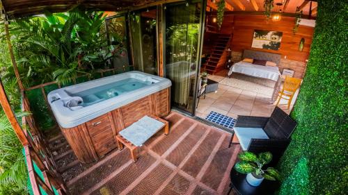 an overhead view of a bath tub in a garden at Bungalows Las Iguanas Arenal Volcano in Chachagua