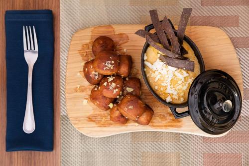a plate of food on a table with a fork at Embassy Suites by Hilton Phoenix Downtown North in Phoenix