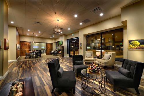 a lobby with couches and chairs and a table at Hotel Maison Yakima Tapestry Collection by Hilton in Yakima