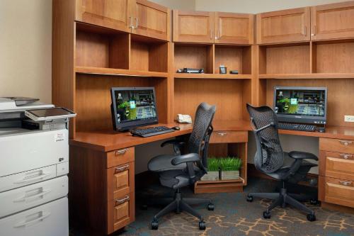 an office with two desks with two computers on them at Hilton Garden Inn Yakima Downtown in Yakima