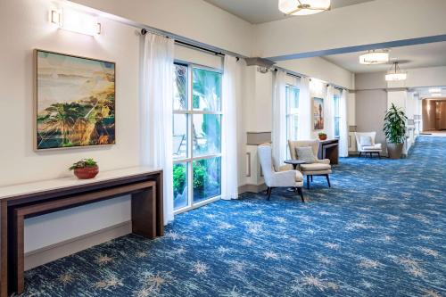 a lobby with chairs and a painting on the wall at Hilton Garden Inn San Diego/Rancho Bernardo in Rancho Bernardo