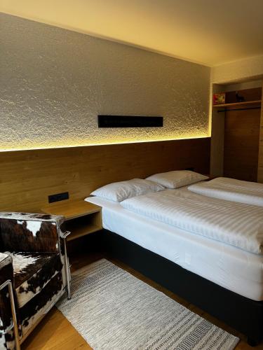 a room with two beds and a table at Appartementhaus Birkenwald in Seefeld in Tirol