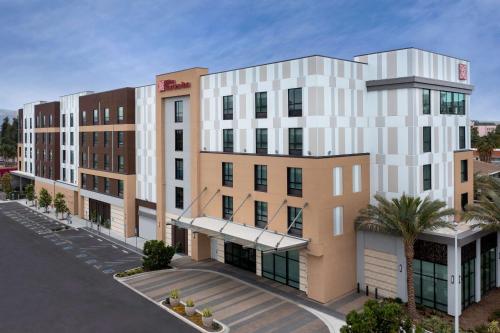 an architectural rendering of a building in a city at Hilton Garden Inn San Jose Airport in San Jose