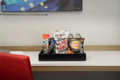 a tray of snacks and chips on a table at Hilton Garden Inn San Jose Airport in San Jose