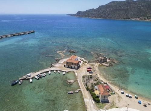 an aerial view of a small island in the water at Fully Equipped Beach House at Pachia Ammos Plytra in Plitra