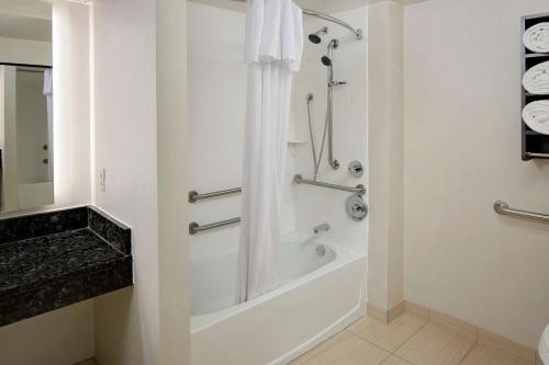 a bathroom with a shower and a bath tub at Homewood Suites by Hilton - Boston/Billerica-Bedford in Billerica