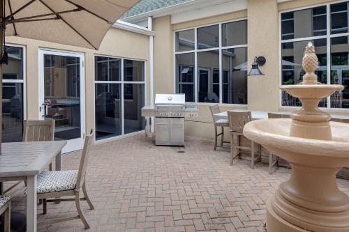a patio with a table and chairs and a fountain at Homewood Suites by Hilton - Boston/Billerica-Bedford in Billerica