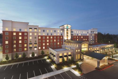 a rendering of a large building with a parking lot at Embassy Suites Portland/Hillsboro in Hillsboro