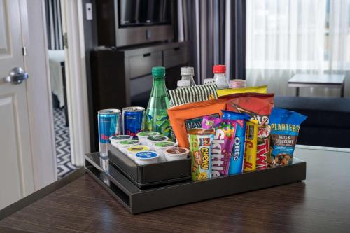 a tray filled with snacks and drinks on a table at Embassy Suites Portland/Hillsboro in Hillsboro