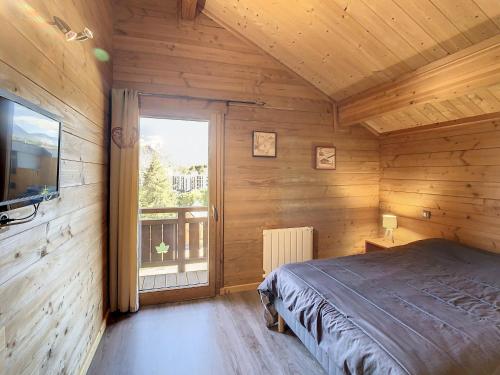 En eller flere senge i et værelse på Chalet haut de gamme 14 pers, 6 chambres, sauna, proche pistes - FR-1-416-23