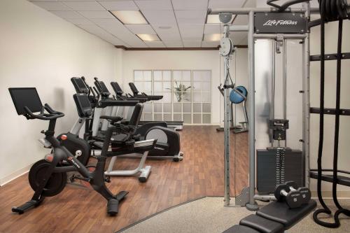 a gym with several treadmills and cardio machines at Embassy Suites by Hilton Dulles North Loudoun in Ashburn