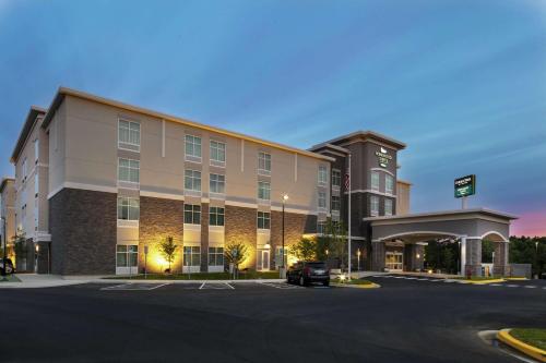 a building with a car parked in front of it at Homewood Suites By Hilton Largo Washington Dc in Largo
