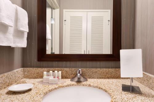 a bathroom with a sink and a mirror at Courtyard Akron Fairlawn in Montrose