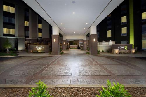 an empty lobby of a building with a walkway at Hampton Inn Louisville East Hurstbourne in Louisville