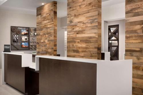 a wine tasting room with a wooden accent wall at Home2 Suites By Hilton Birmingham Downtown in Birmingham