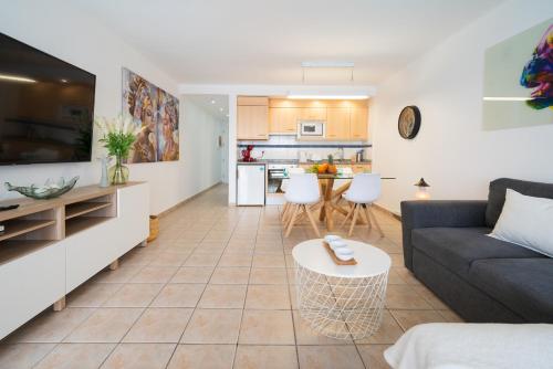 a living room with a couch and a table at Lanzahost Casa Juan in Costa Teguise