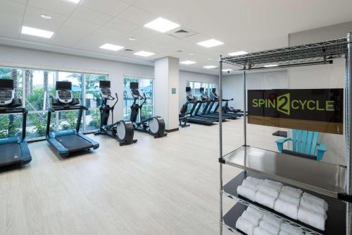 a gym with treadmills and elliptical machines at Hampton Inn & Suites Cape Canaveral Cruise Port, Fl in Cape Canaveral