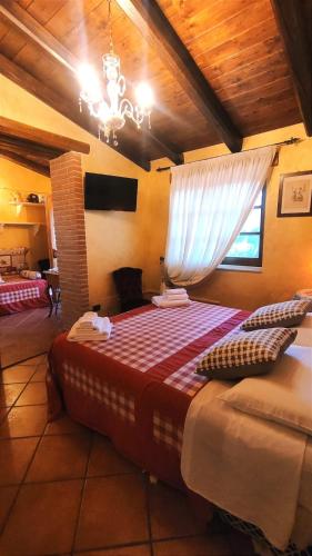 Postel nebo postele na pokoji v ubytování L'antica quercia