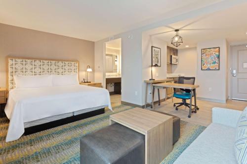 a hotel room with a bed and a desk at Homewood Suites by Hilton St Augustine San Sebastian in Saint Augustine