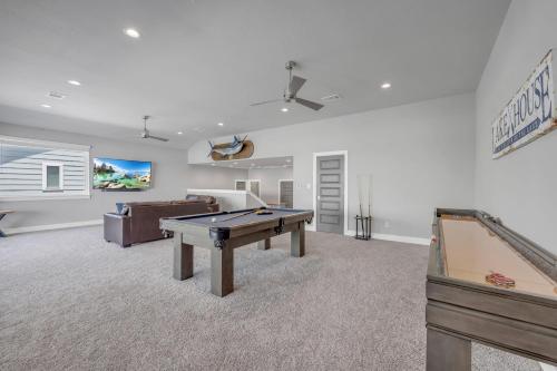 a living room with a pool table and a couch at Rolling Waves Haven Concierge Services Available in Kingsland
