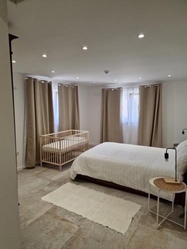 Ένα ή περισσότερα κρεβάτια σε δωμάτιο στο Casa Nikana