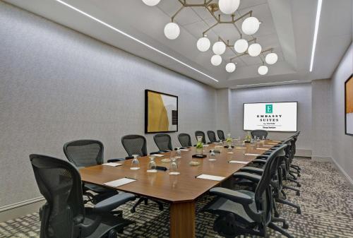 a large conference room with a long table and chairs at Embassy Suites Chicago - Downtown River North in Chicago