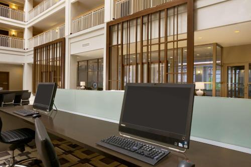 an office with a desk with a computer on it at Embassy Suites Chicago - Downtown River North in Chicago
