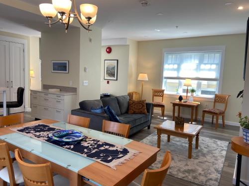 a living room with a couch and a table at Windsor Guest House in Vancouver