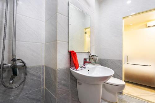 a bathroom with a sink and a toilet and a shower at Mai Phương - RUBY SAIGON HOTEL in Ho Chi Minh City