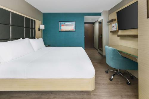 En eller flere senge i et værelse på Hilton Garden Inn New York Times Square North