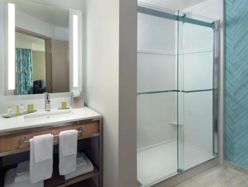 a bathroom with a glass shower and a sink at Hilton Garden Inn Atlanta-Buckhead in Atlanta