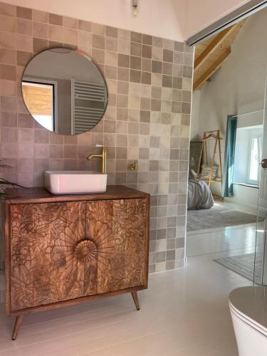 a bathroom with a sink and a mirror at Villa Tité in Oviedo