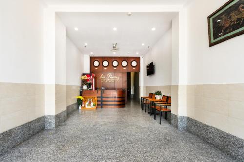 a lobby of a restaurant with tables and chairs at Mai Phương - RUBY SAIGON HOTEL in Ho Chi Minh City