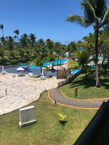 a view of a swimming pool from a resort at Beach class Muro Alto 3202 in Porto De Galinhas