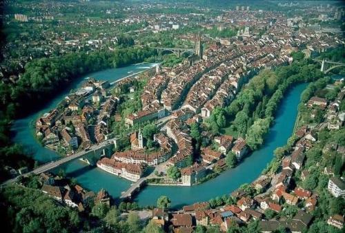 an aerial view of a city with a river at Bern room near Main Station in Bern
